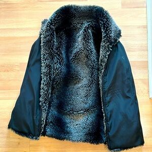 Reversible black and fur vest